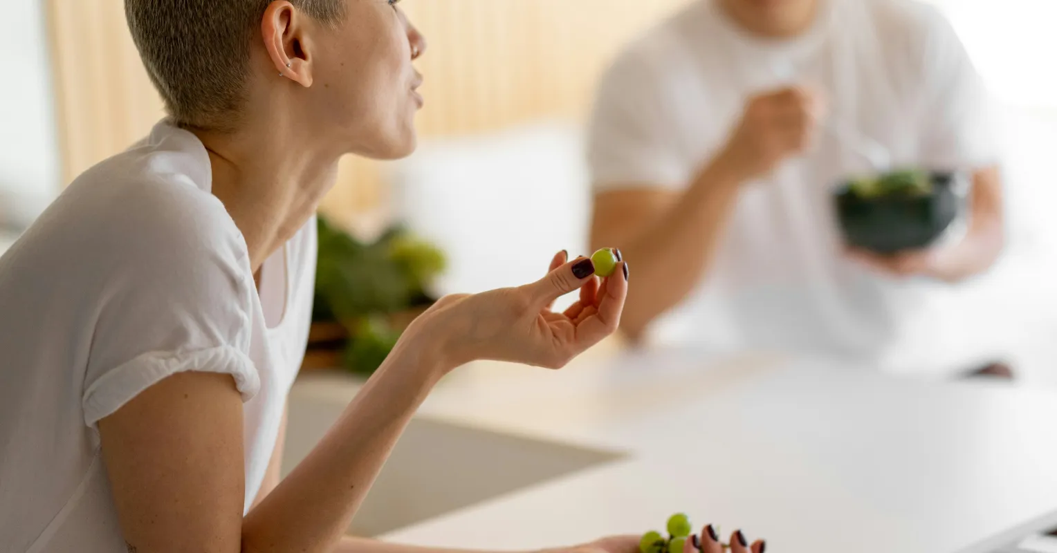Individual processing their emotions while partner appears overwhelmed by emotional expression