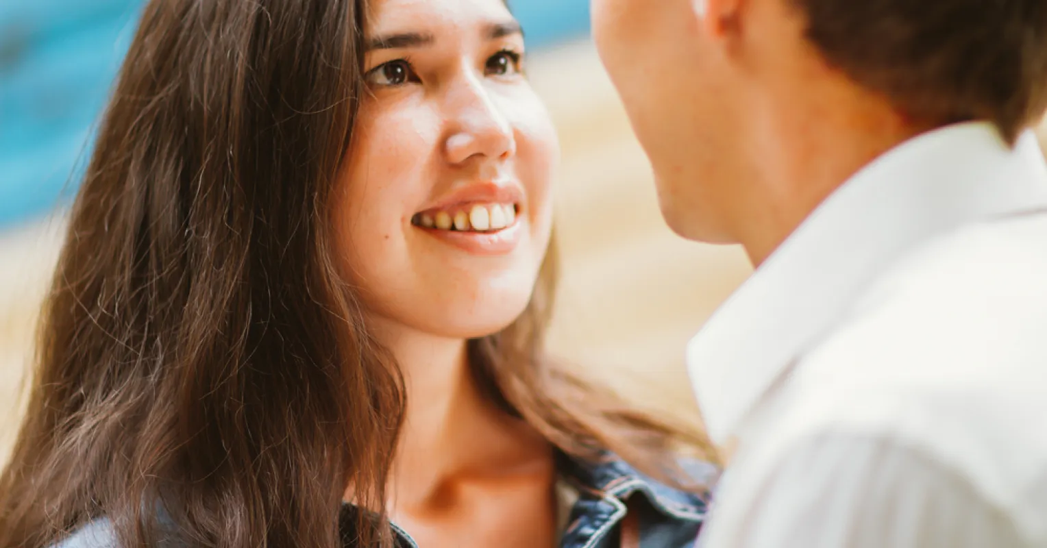 Individual engaged in a conversation, reflecting on attraction to honesty in social settings