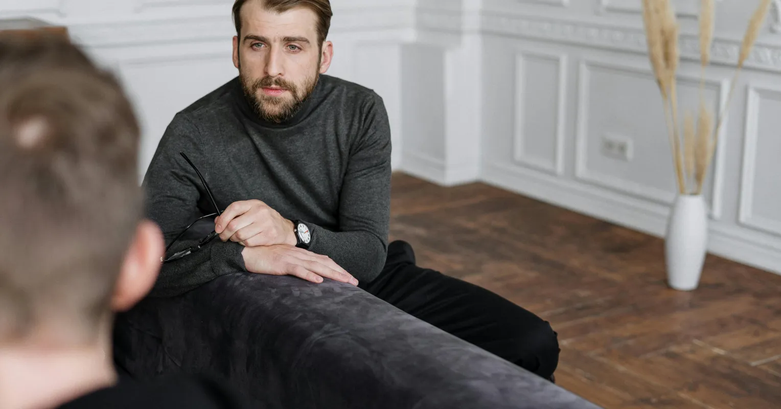 Person reflecting on uncertainty in a relationship connected to what should i do if my partner dismisses my