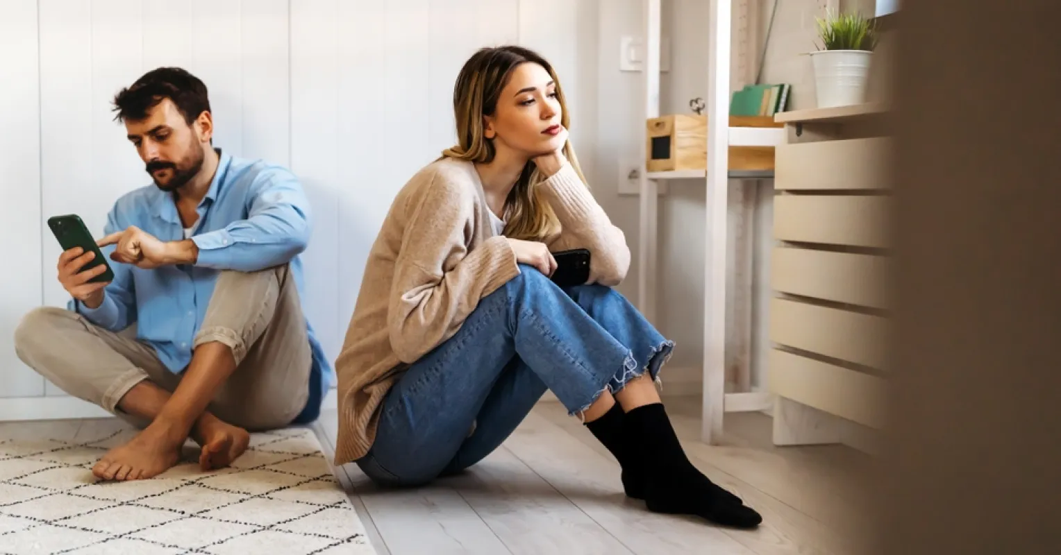 Person reflecting on uncertainty in a relationship connected to what to do when your partner perceives your emotions