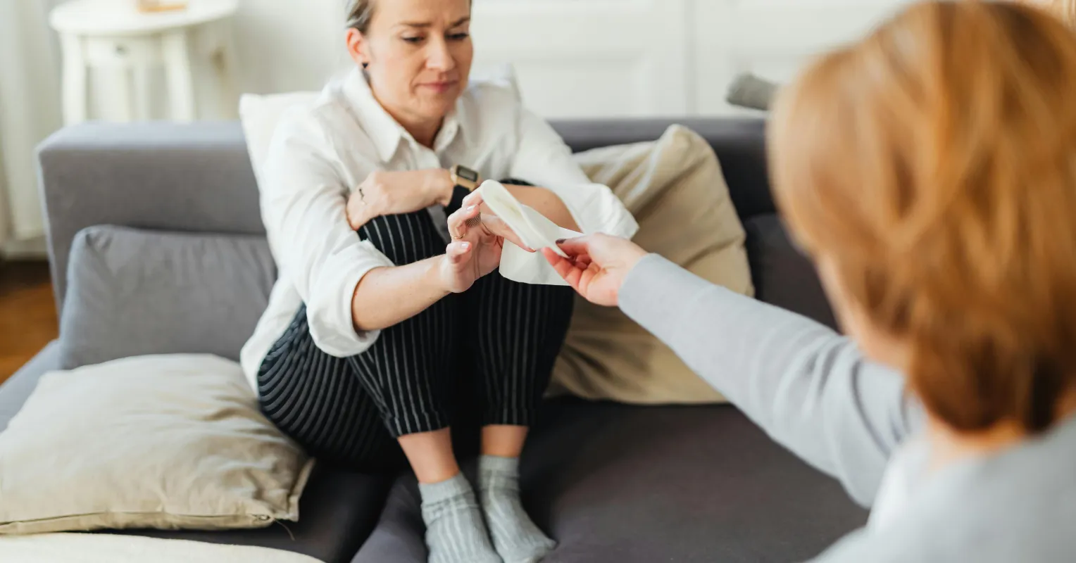 Couple communicating with mixed emotions, exploring why discussing feelings creates pressure in relationships
