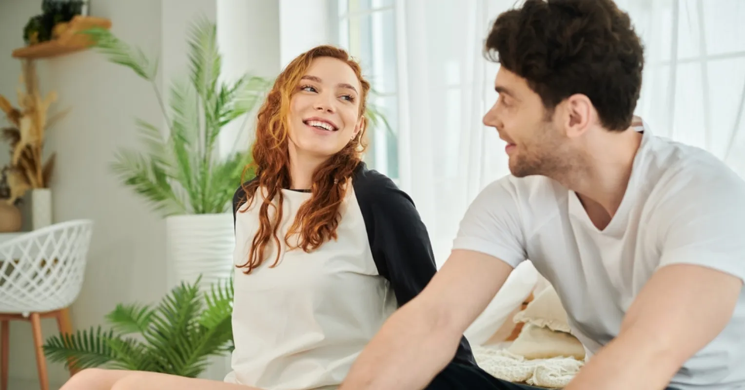 Couple experiencing tension during a conversation about early dating conflicts.