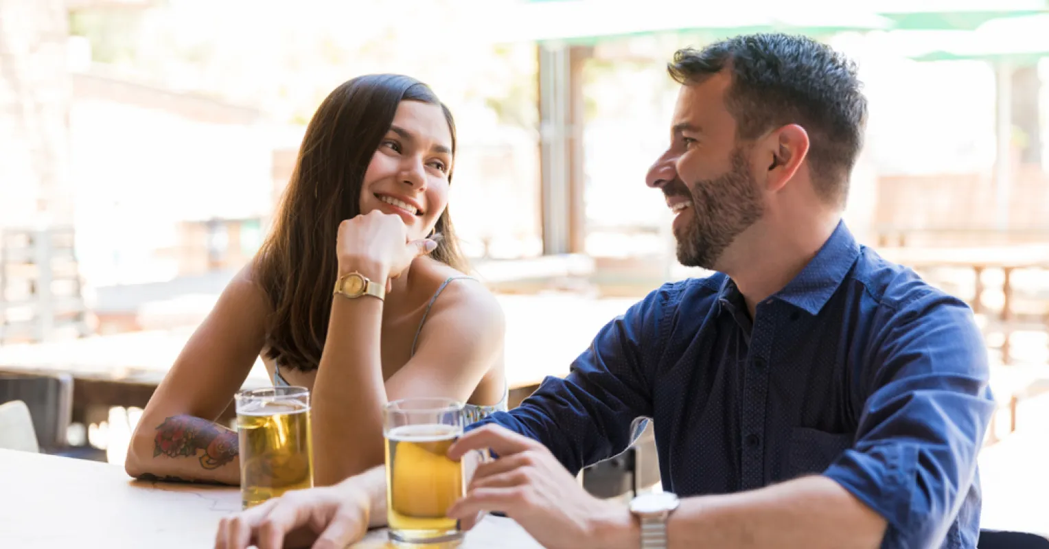 A person feeling anxious while on a date, contemplating fear of rejection
