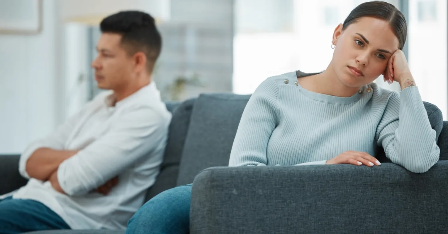 Individual contemplating rejection fears while enjoying a peaceful moment with a partner