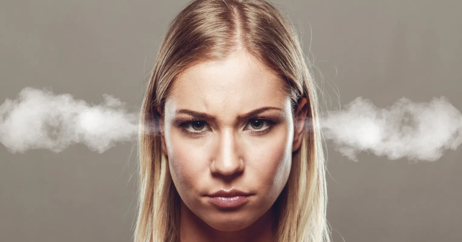 Couple looking confused and frustrated while discussing feelings of unexplained anger