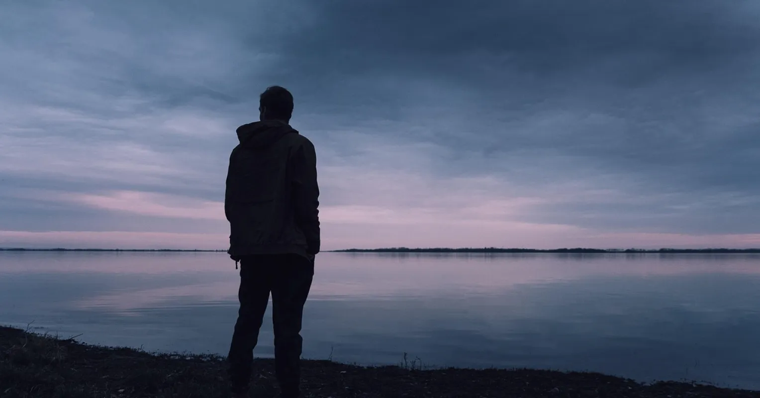 Person engaging in meaningful conversation with a stranger, feeling deeper connection than with friends