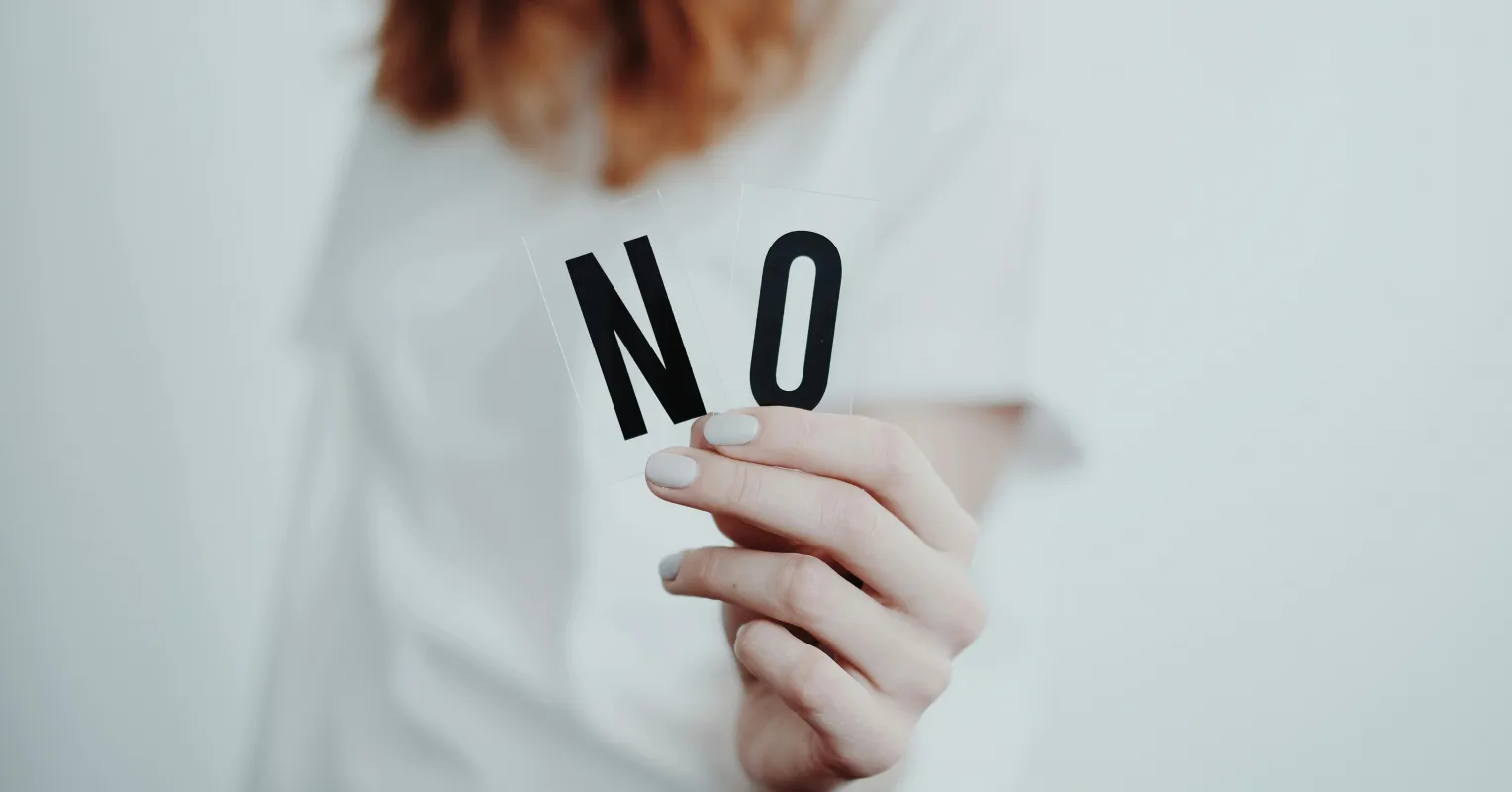 Person experiencing frustration due to ignored personal boundaries in a social setting