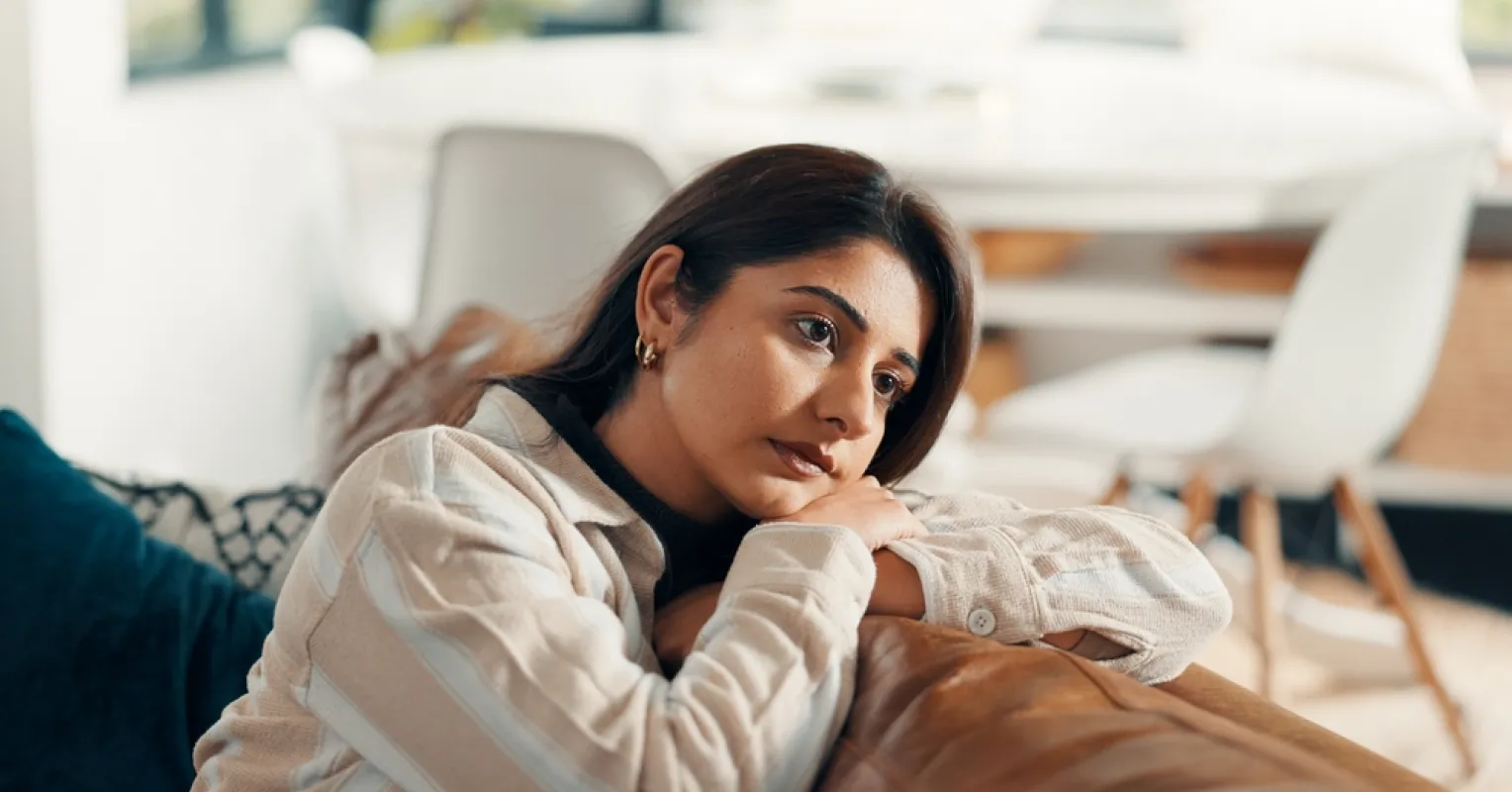 Individual contemplating the reasons behind self-sabotage in relationships.