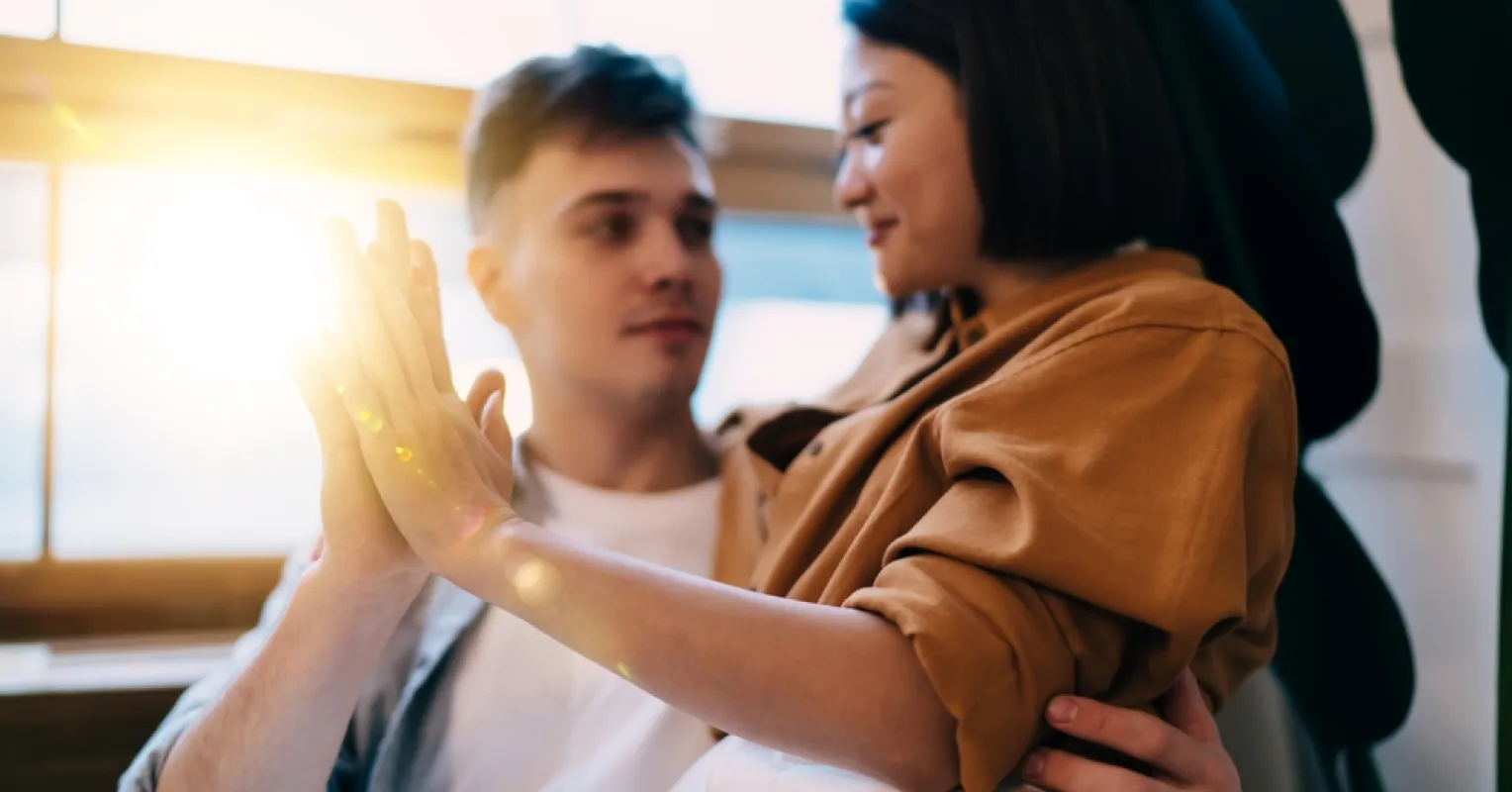 Person contemplating their feelings about an ex while in a new relationship