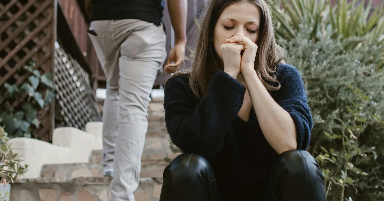 Individual contemplating overwhelming thoughts about their ex after relationship rejection