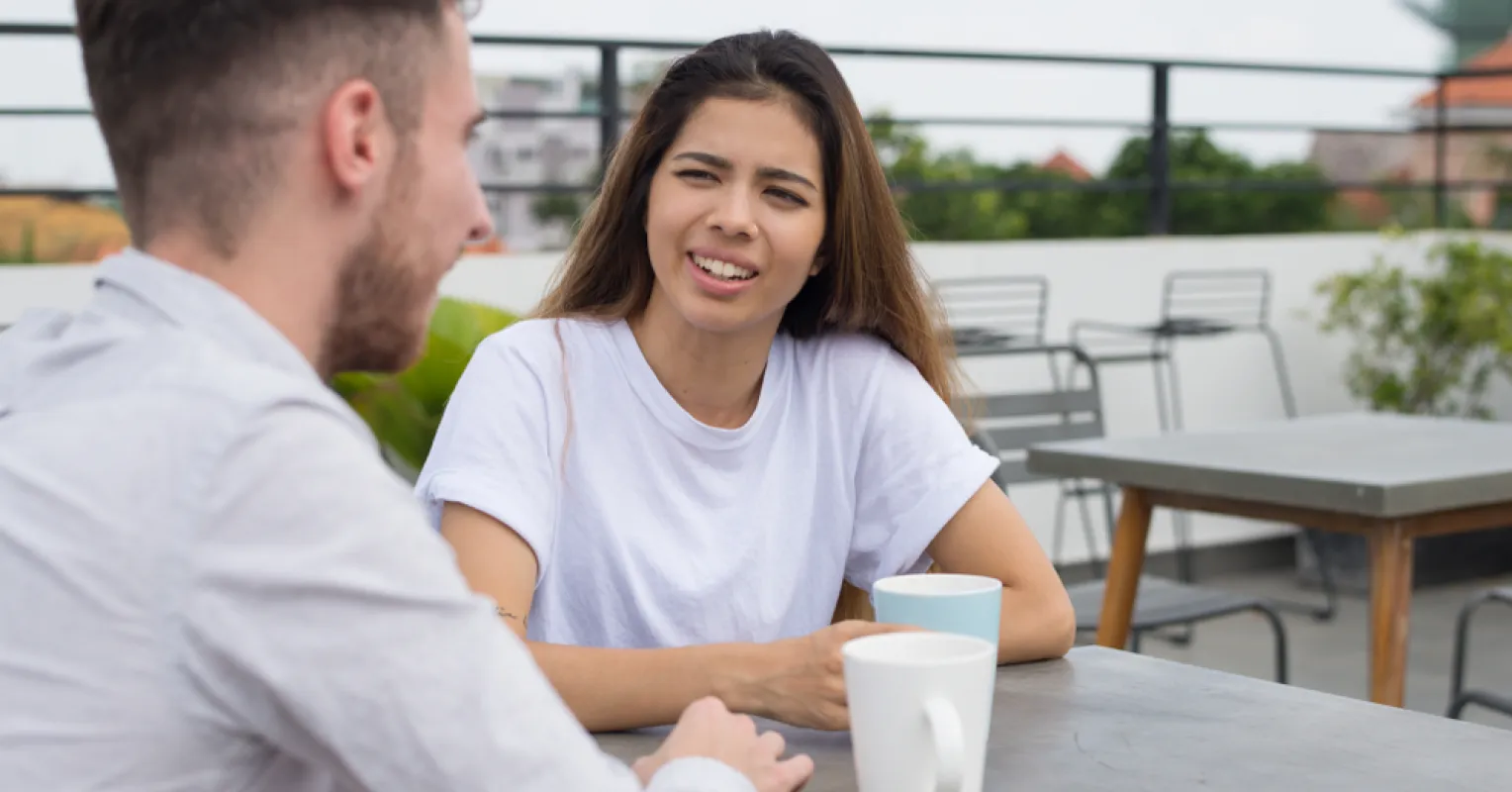 Person analyzing thoughts about relationship signals after an awkward first date