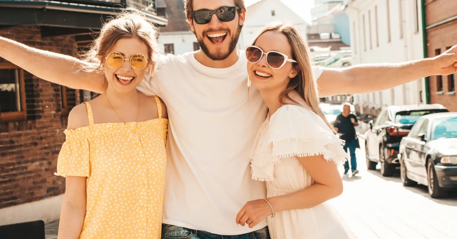 Two friends effortlessly enjoying themselves while others struggle to connect in social dynamics