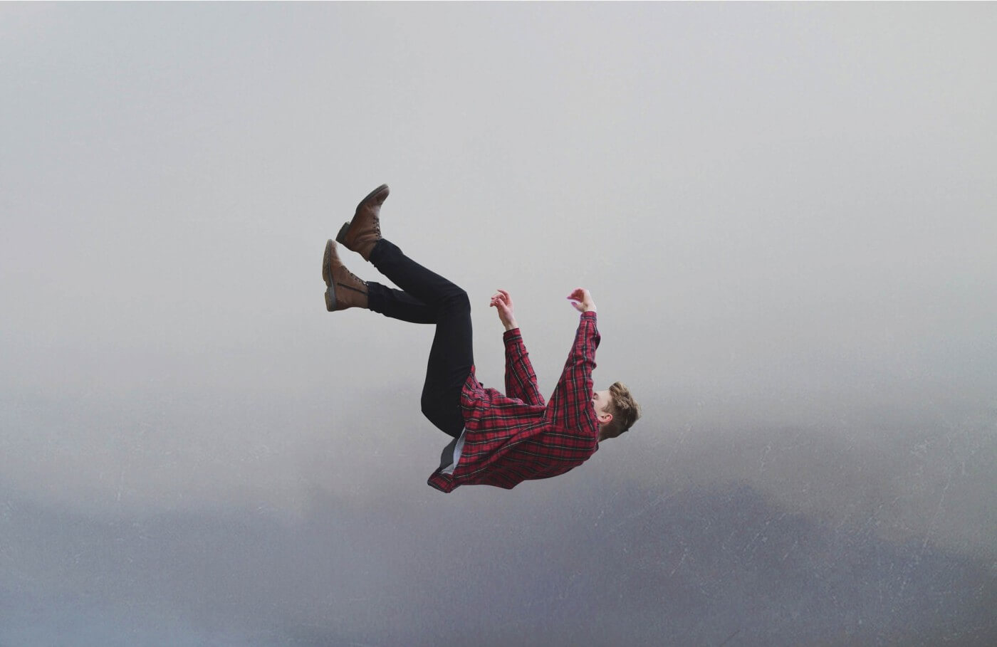 Individual grappling with emotions while contemplating the difficulty of letting go in relationships
