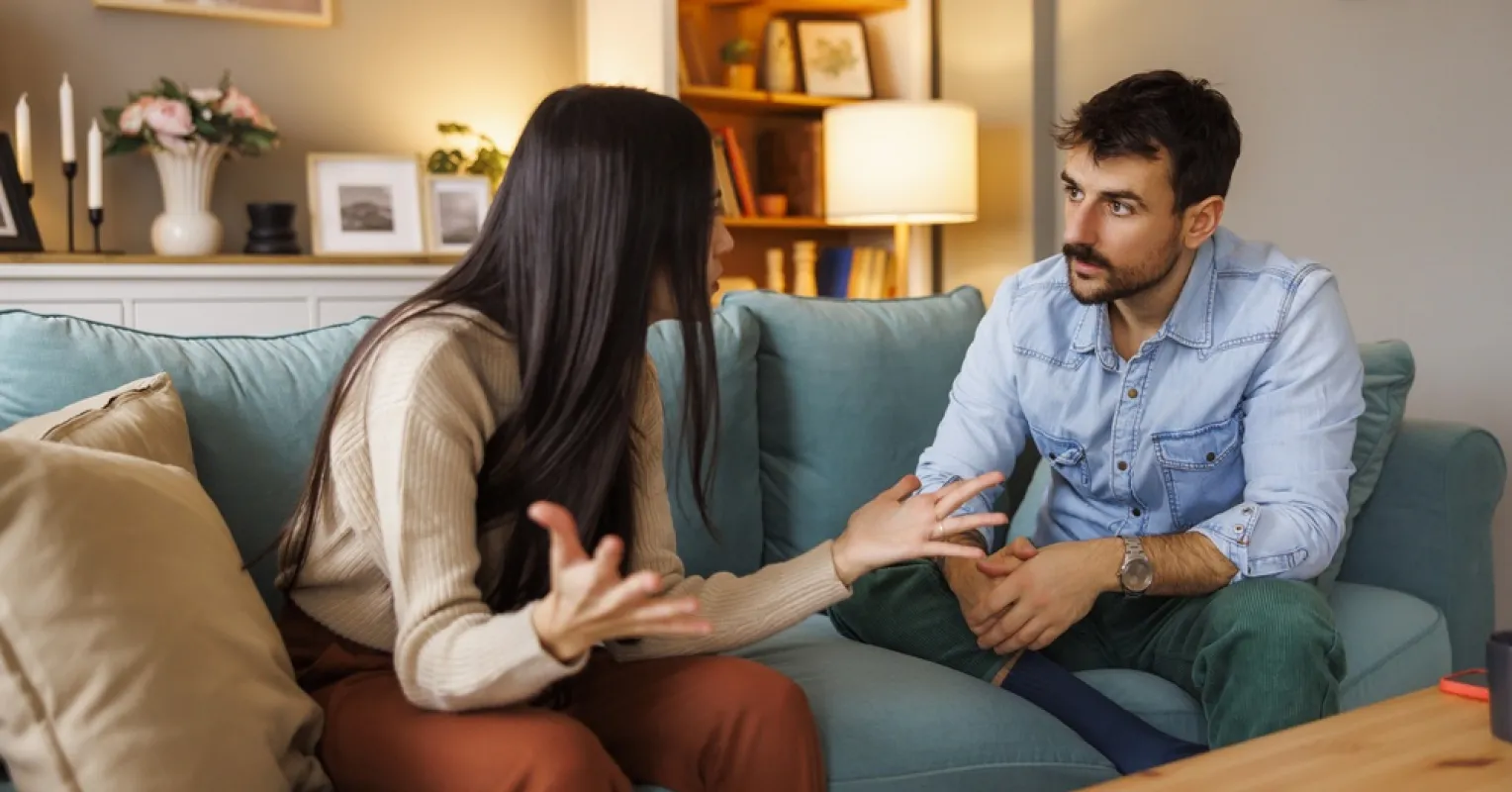 Couple discussing feelings and needs during an emotional conversation in a quiet setting