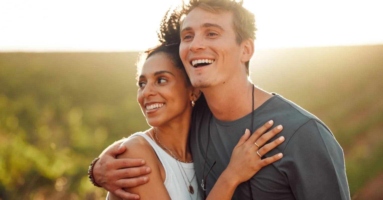 Couple sitting together yet exhibiting emotional distance, exploring intimacy issues and relationship signals.