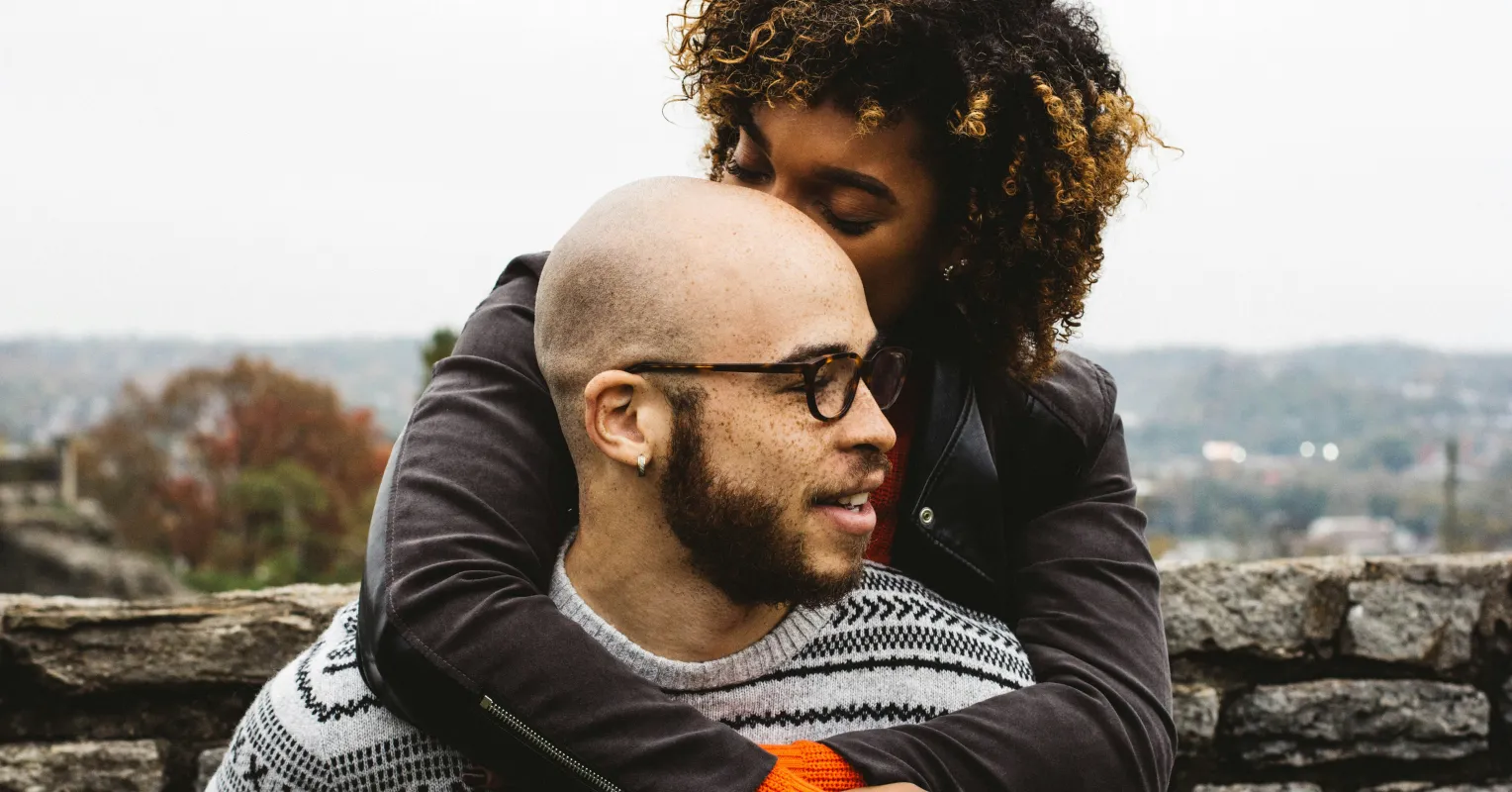 Couple discussing financial concerns, reflecting anxiety about spending habits