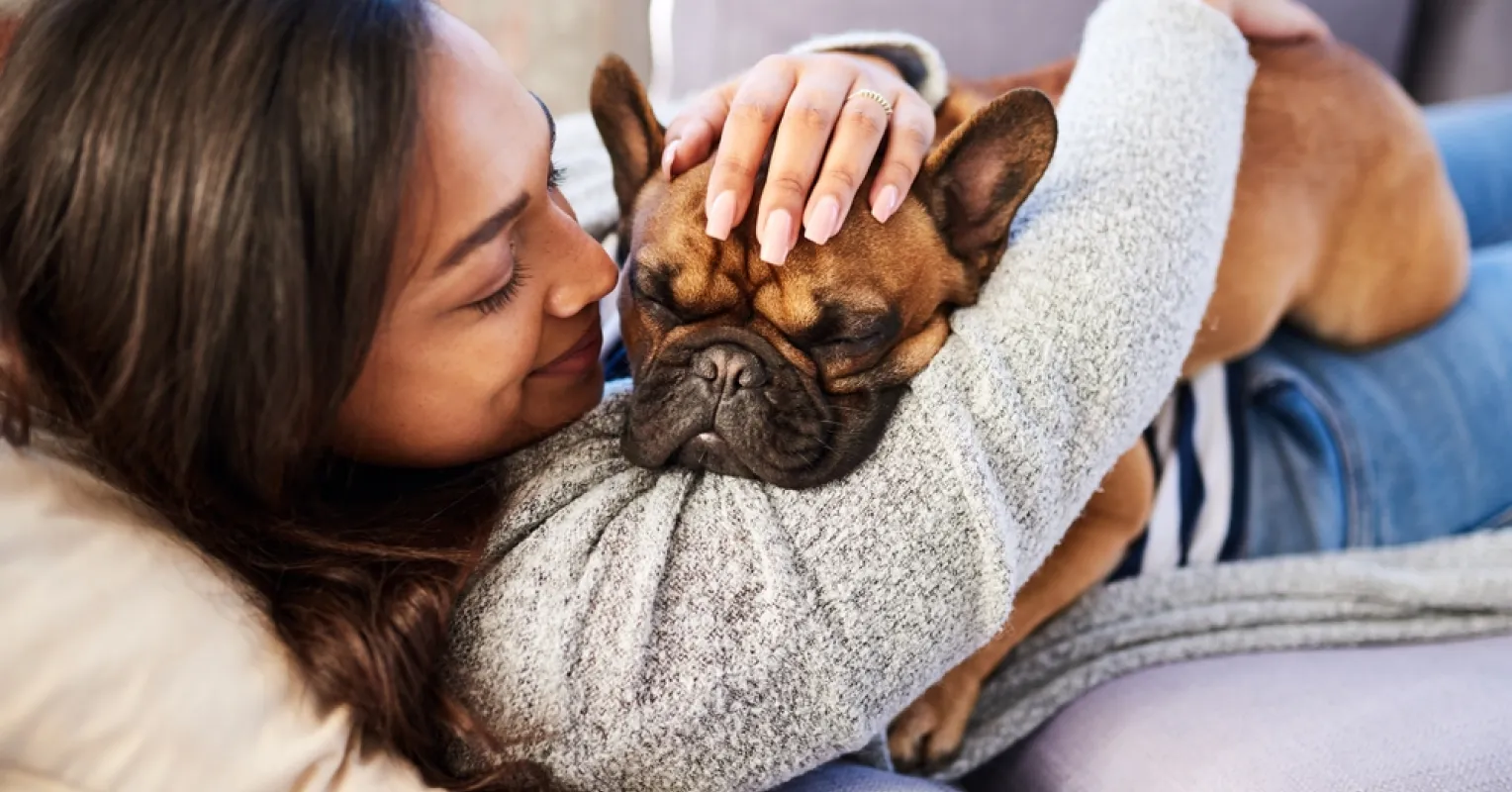 Person contemplating feelings of guilt about leaving a pet alone at home