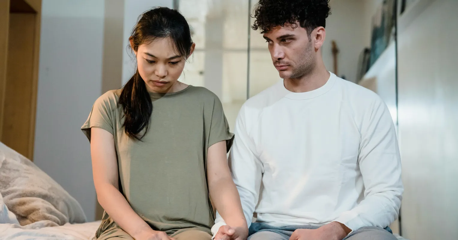 Couple experiencing overwhelming emotions during an argument, reflecting relationship signals.