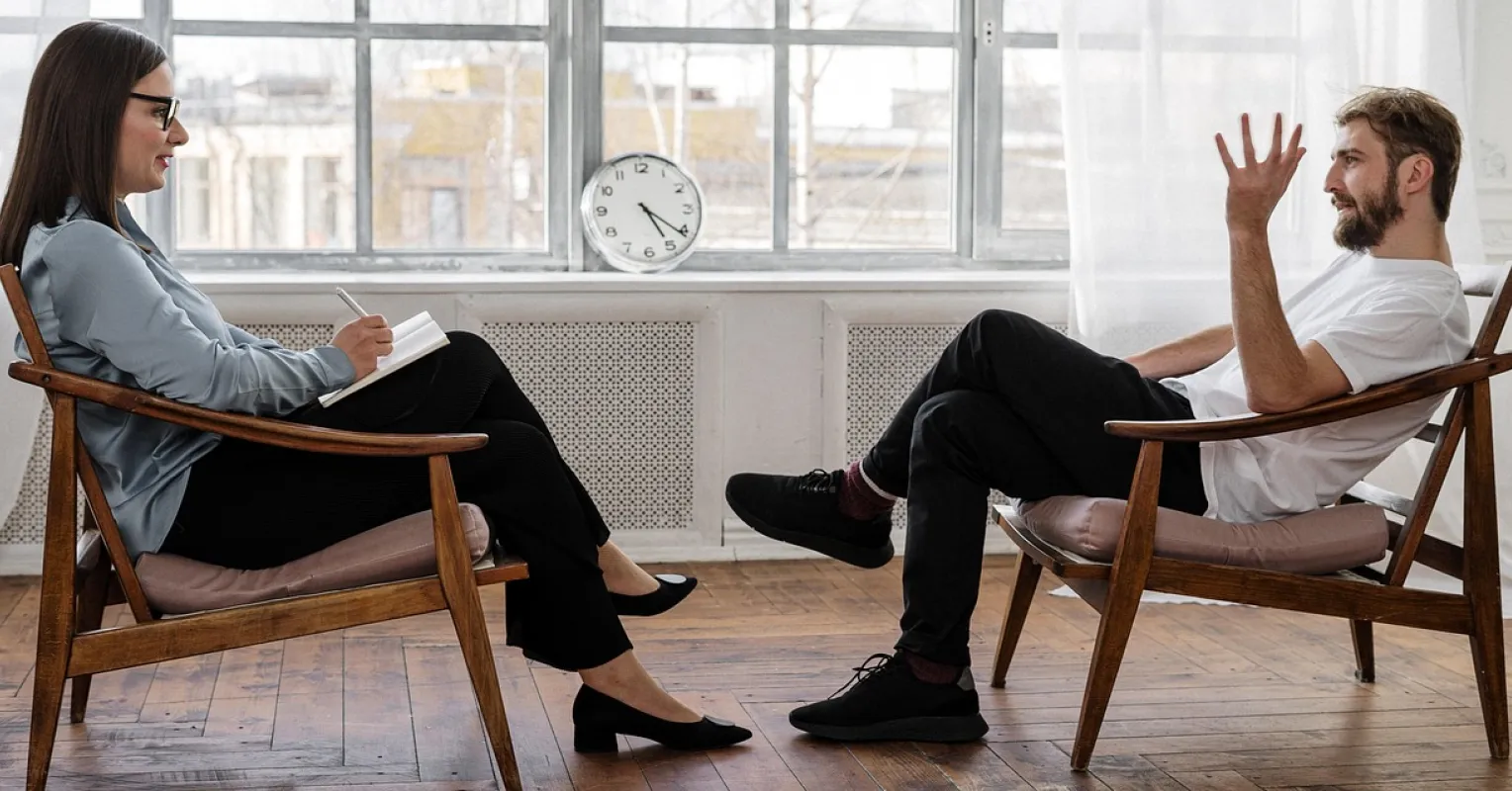 A person contemplating the emotional signals of disconnect with their therapist
