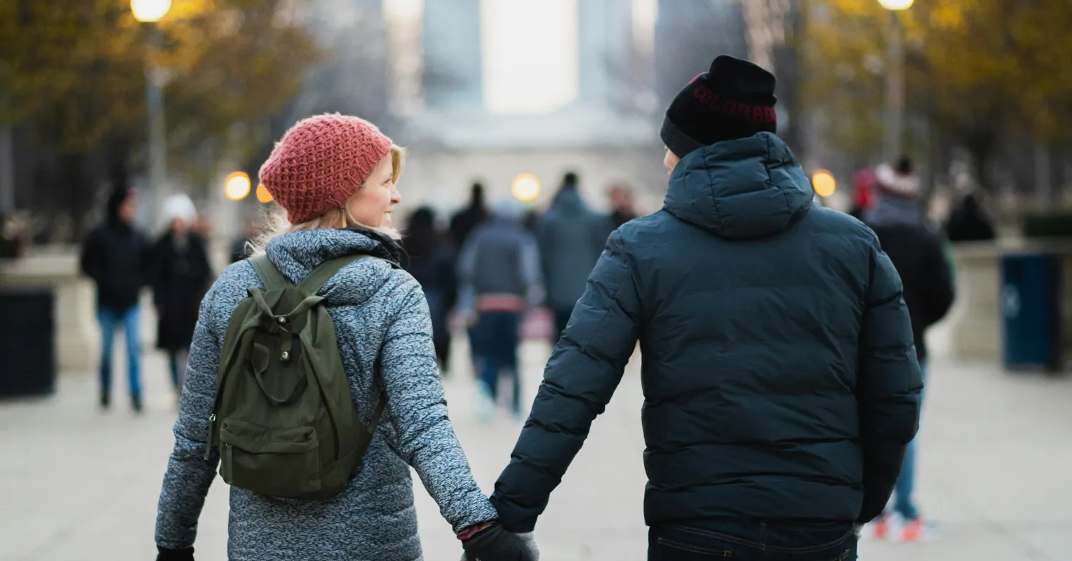 Couple sitting apart, feeling disconnected after an argument, reflecting on relationship signals.