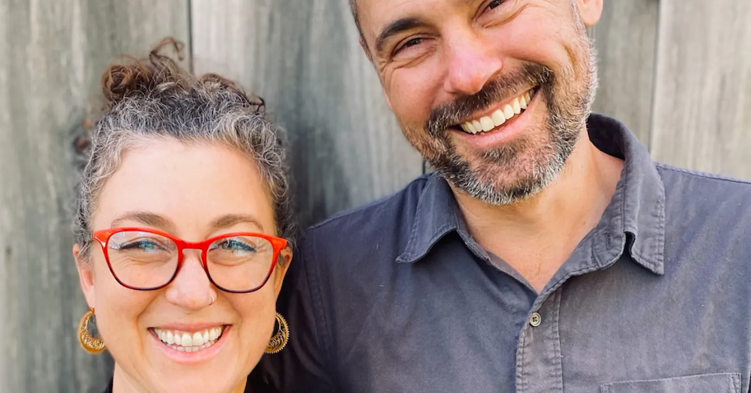 Couple navigating emotional tension while discussing spiritual beliefs and feelings