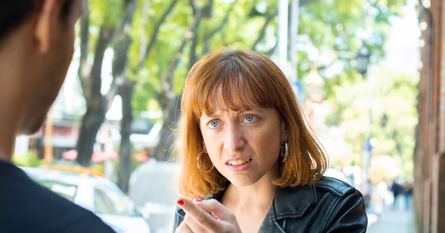 Individual contemplating how to interpret pushy behavior in relationships during a difficult conversation
