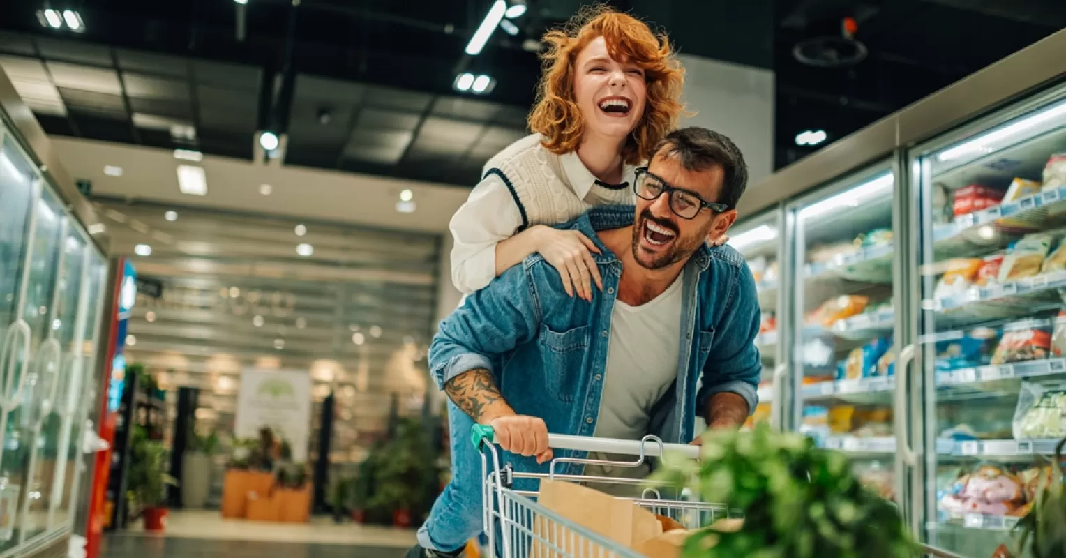 Couple sharing laughter and connection during a quiet moment in their busy relationship
