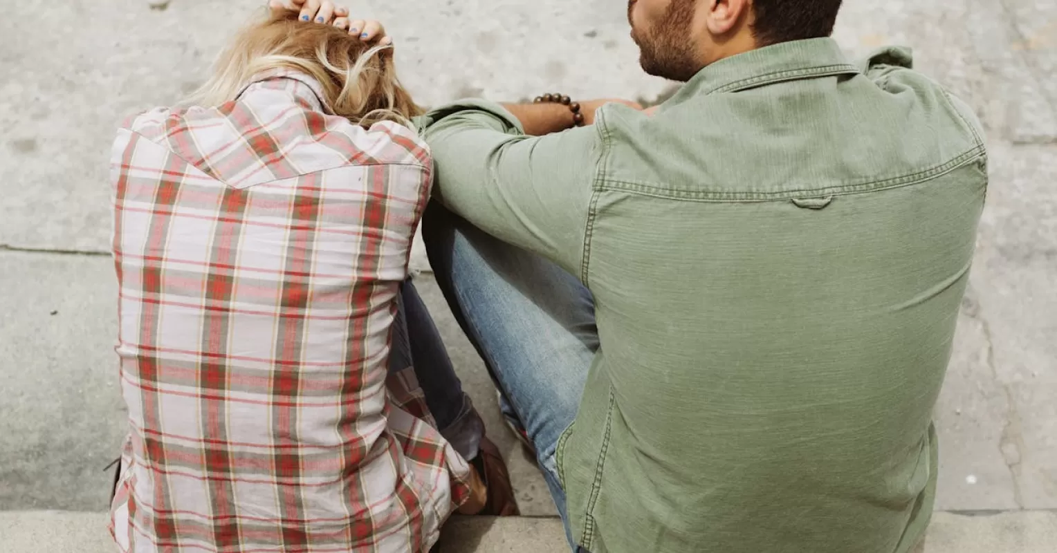 Adult reflecting on childhood experiences that influence love through projection in relationships