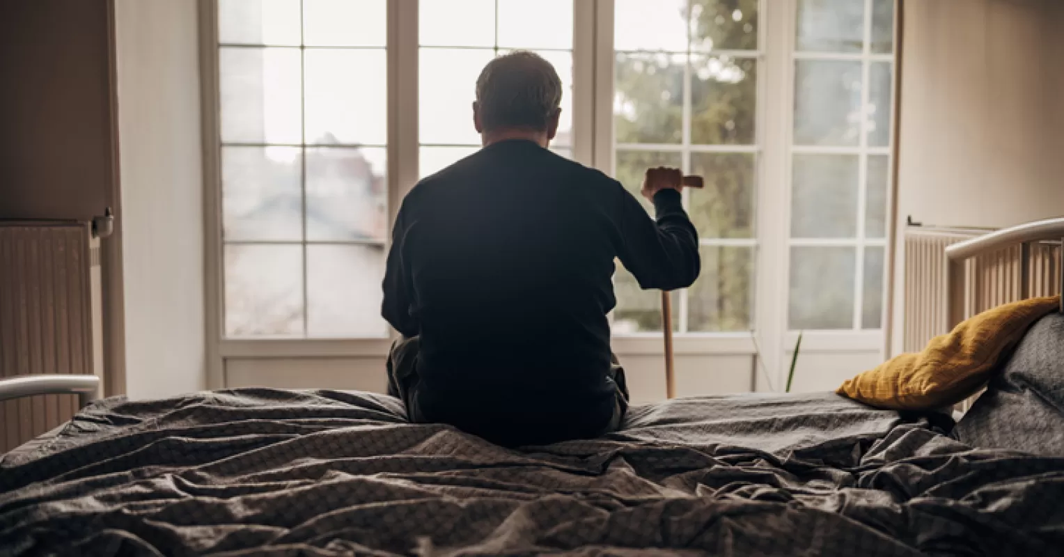 A compassionate interaction between a young person and an elderly individual addressing invisibility issues.