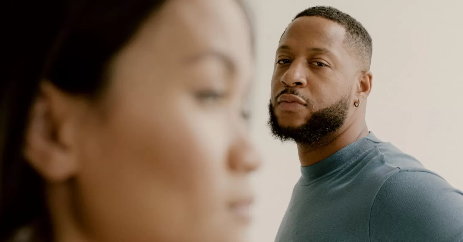 Couple sitting together, discussing feelings of doubt in their long-term relationship
