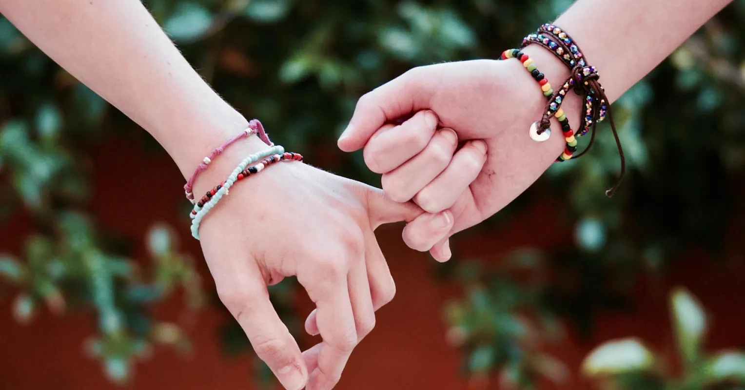 Two friends sharing a candid conversation, revealing intentions after a breakup
