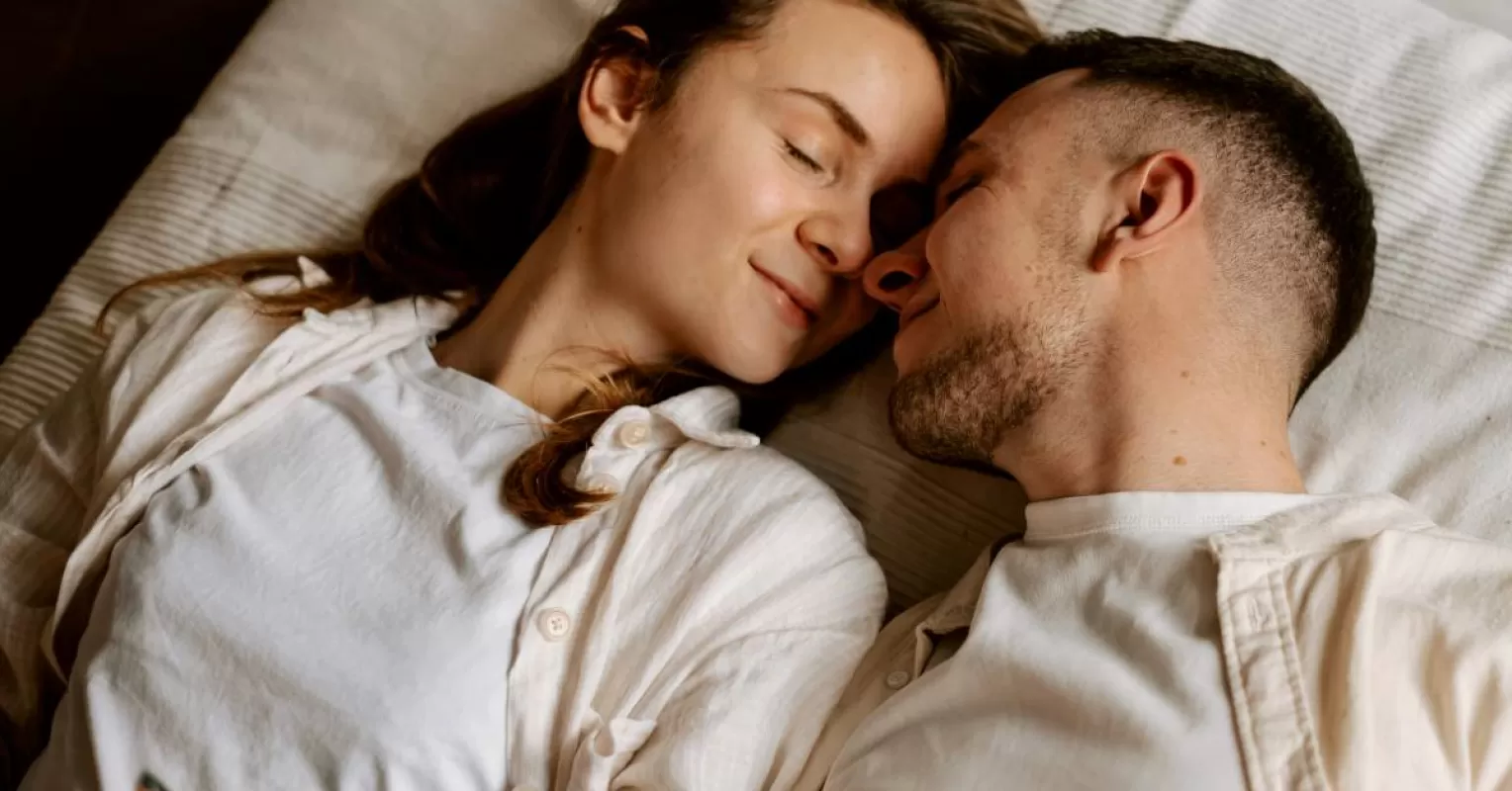 Person reflecting on uncertainty in a relationship connected to how to maintain connection when your partners schedul...