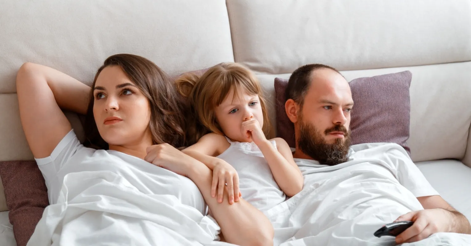 Couple discussing emotional distance challenges after the arrival of their child