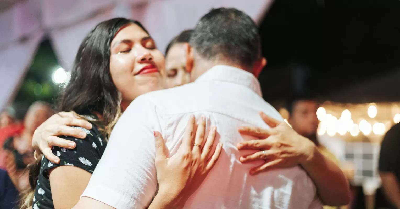 Couple sharing a warm embrace, reconnecting after children have moved out