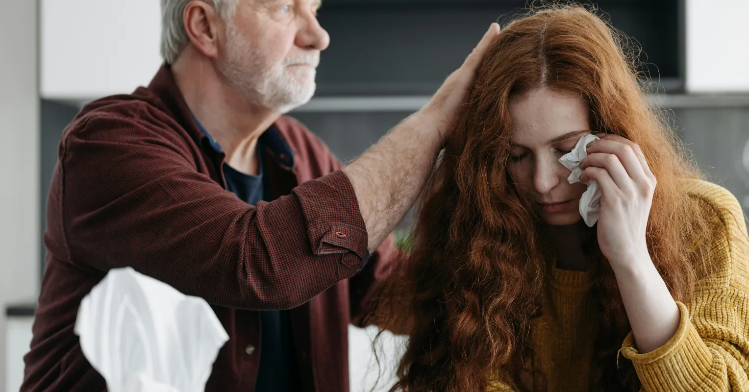 Family members reconnecting while discussing feelings after a gray divorce to rebuild trust