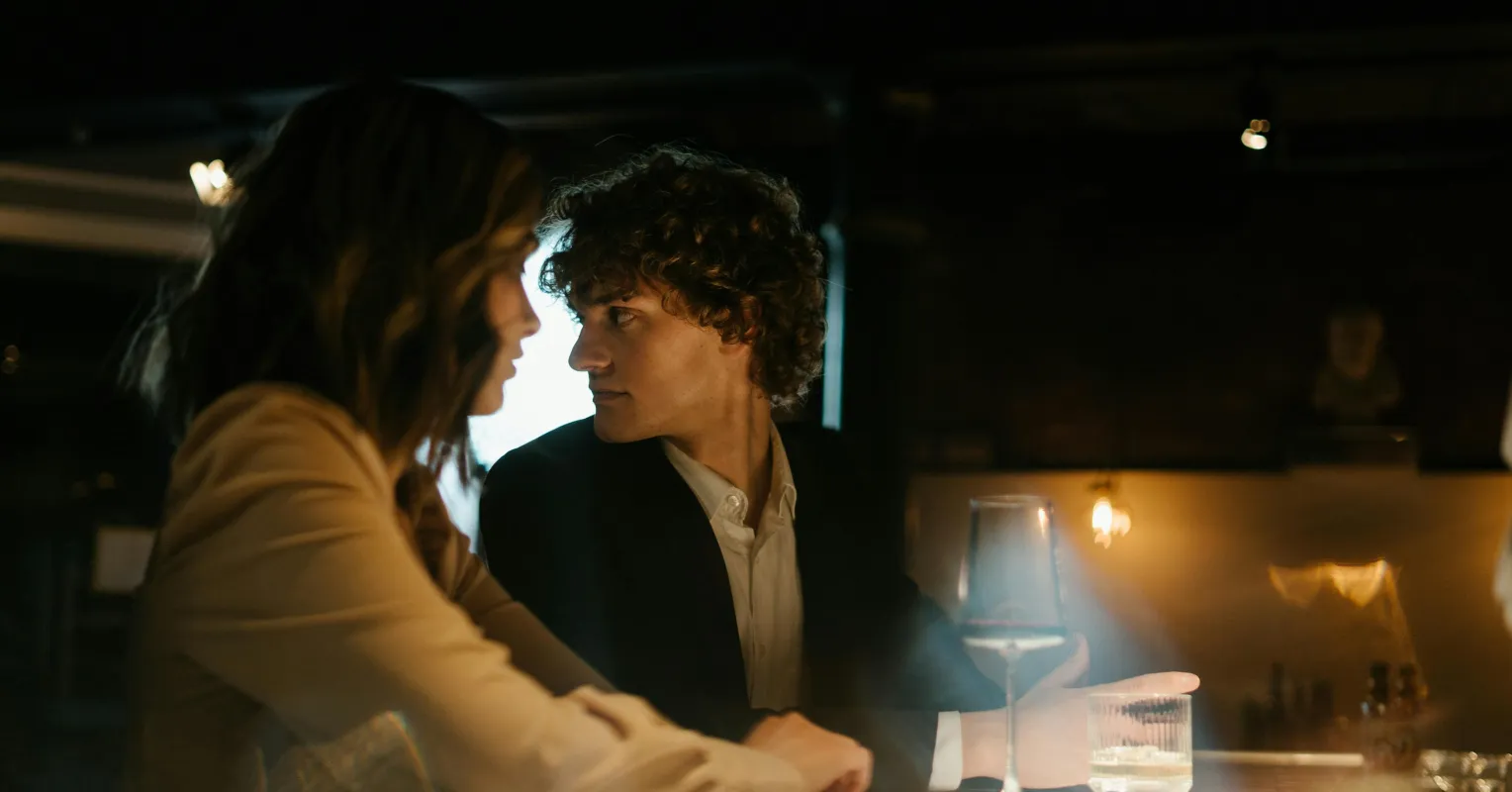 Couple discussing feelings of jealousy in an open relationship setting