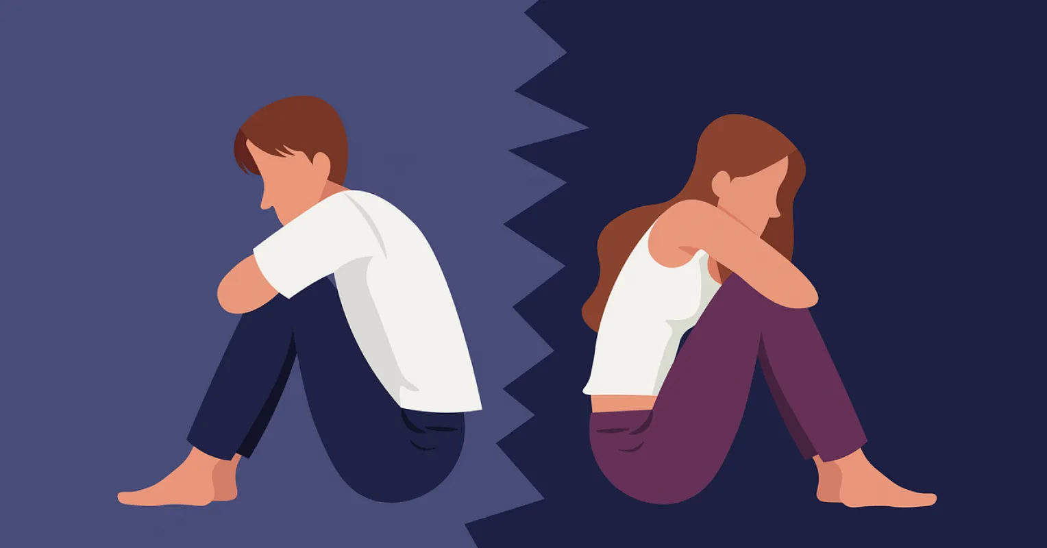 Couple sitting apart, reflecting on feelings to reconnect during emotional distance.