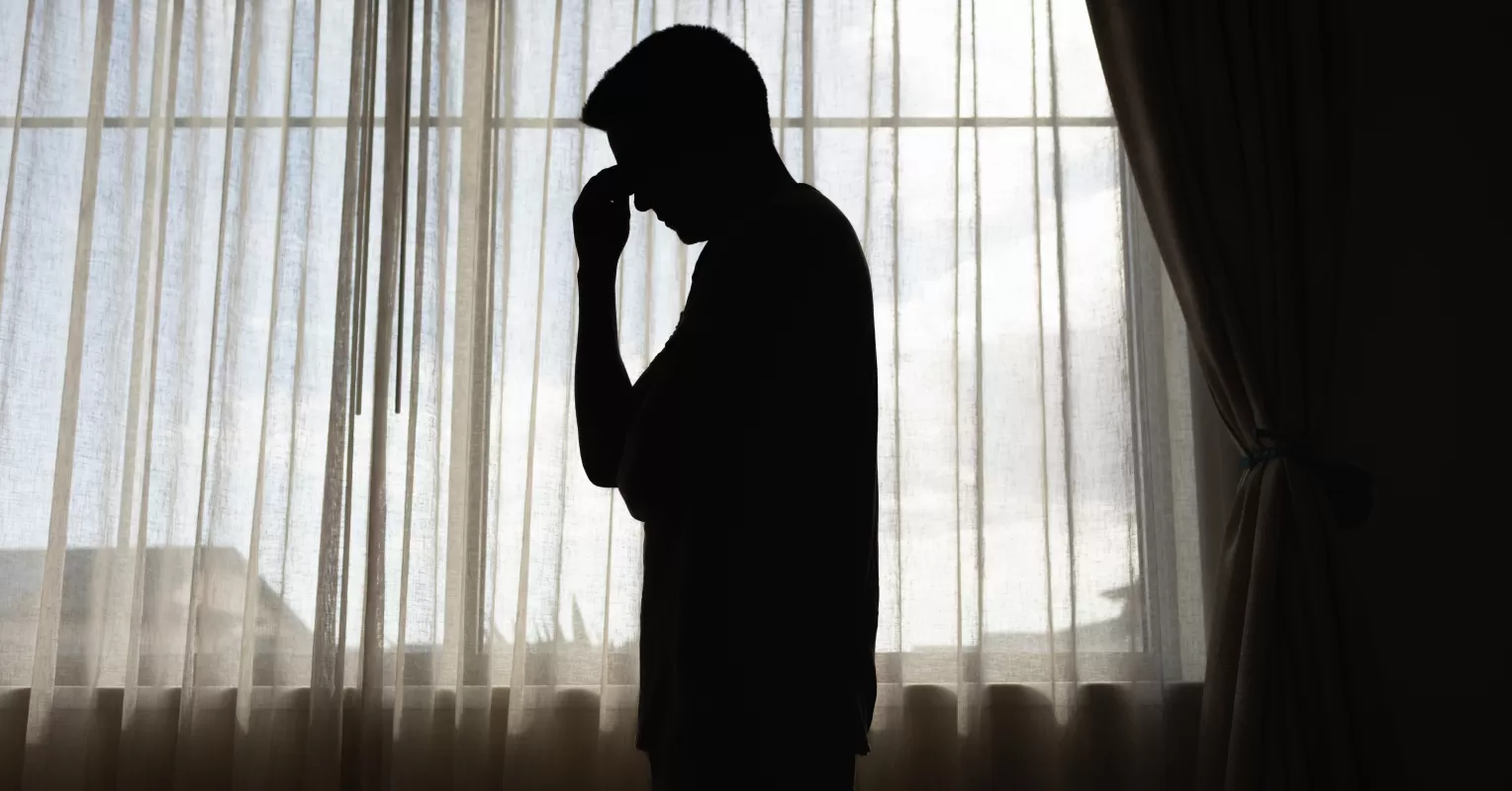 A person sitting quietly, reflecting on their emotions after experiencing long numbness
