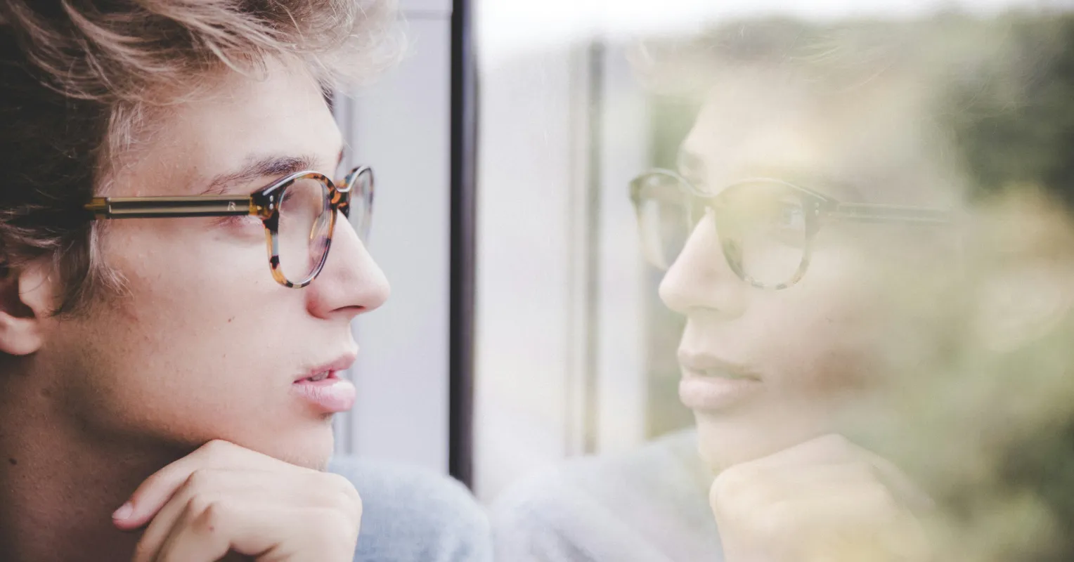 Person reflecting on uncertainty in a relationship connected to how can i stop feeling rejected when my partner