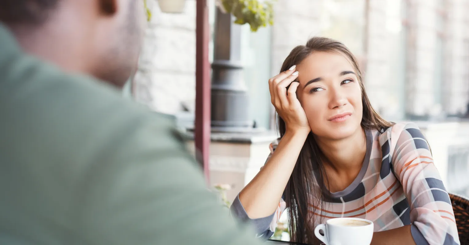 Person contemplating if they're overreacting to minor dating quirks during a conversation.