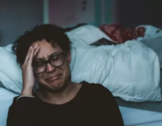 Individual contemplating feelings of anger and confusion after a marriage ends