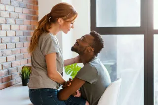 Person feeling overlooked in a relationship, reflecting on their secondary emotional needs