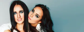 Two friends embrace, illustrating the bond and emotional connection after hugging.
