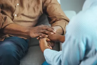 Couple pausing during a discussion, reflecting on forgiveness without accountability