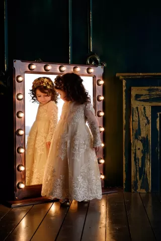 Parent observing a child's playful actions while managing emotional triggers