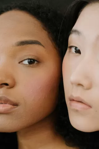 Person contemplating dating insecurities related to skin tone in a thoughtful moment