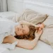 Couple in bed communicating emotions and addressing pleasure authenticity in their relationship