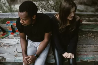 A couple experiencing emotional withdrawal after feeling close, highlighting relationship signals.