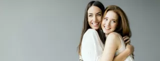 Person looking uncertain before hugging someone they care about, reflecting on relationship signals
