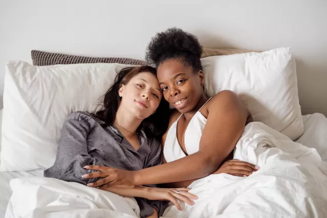 Couple communicating with uncertain expressions over a surface-level yes in their conversation